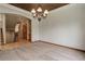 Elegant dining room area with unique ceiling treatment and lighting fixture, perfect for entertaining guests at 12825 W 81St Ave, Arvada, CO 80005