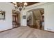 The dining room features decorative ceilings, a stylish chandelier, and carpeted flooring at 12825 W 81St Ave, Arvada, CO 80005