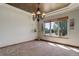 The dining area boasts natural light, a decorative ceiling, and a view of the lush neighborhood at 12825 W 81St Ave, Arvada, CO 80005