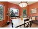 Bright dining area featuring a large window with views of the landscaped backyard at 12825 W 81St Ave, Arvada, CO 80005