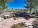 Backyard fire pit area with stone pavers and seating, ideal for gatherings at 12825 W 81St Ave, Arvada, CO 80005