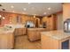Gourmet kitchen with granite countertops, a large island, stainless steel appliances, and hardwood floors at 12825 W 81St Ave, Arvada, CO 80005