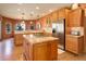Spacious kitchen with custom cabinets, granite countertops, stainless steel appliances, and a central island at 12825 W 81St Ave, Arvada, CO 80005