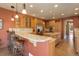 Updated kitchen with granite counters, a breakfast bar, custom cabinets, and stainless steel appliances at 12825 W 81St Ave, Arvada, CO 80005
