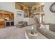 Spacious living room with open staircase and access to the kitchen with a breakfast bar at 12825 W 81St Ave, Arvada, CO 80005