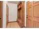 Entryway mudroom featuring a built-in bench, storage cubbies, and hooks for organizing coats and accessories at 12825 W 81St Ave, Arvada, CO 80005