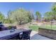 Inviting patio area with comfortable seating and a lush backyard view at 12825 W 81St Ave, Arvada, CO 80005