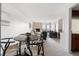 Dining area with four chairs and view of living room at 1313 N Williams St # 703, Denver, CO 80218