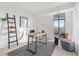 Spacious home office with large window and built-in shelving at 1313 N Williams St # 703, Denver, CO 80218