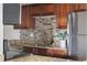 Kitchen with granite countertops and wood cabinets at 1313 N Williams St # 703, Denver, CO 80218