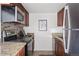 Modern kitchen with stainless steel appliances and granite countertops at 1313 N Williams St # 703, Denver, CO 80218