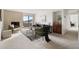 Spacious living room with fireplace and adjacent dining area at 1313 N Williams St # 703, Denver, CO 80218