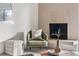 Bright living room with fireplace, and sliding glass door to balcony at 1313 N Williams St # 703, Denver, CO 80218