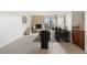 Open living room with fireplace and view to dining area at 1313 N Williams St # 703, Denver, CO 80218