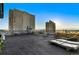 Spacious rooftop deck with city views and lounge seating at 1313 N Williams St # 703, Denver, CO 80218