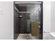 Clean shower with dark gray tile and glass enclosure at 1313 N Williams St # 703, Denver, CO 80218