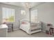 A bedroom with a chandelier, and two windows at 14841 W Warren Ave, Lakewood, CO 80228