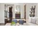 Welcoming foyer features hardwood floors, elegant decor, and stairs, creating a sophisticated first impression at 14841 W Warren Ave, Lakewood, CO 80228