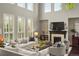 Bright living room with fireplace, lots of natural light and comfortable seating at 14841 W Warren Ave, Lakewood, CO 80228