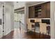 Upstairs office space features hardwood floors, custom cabinets, and natural lighting at 14841 W Warren Ave, Lakewood, CO 80228