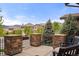 Relaxing patio with stone pillars offers serene neighborhood views, blending outdoor comfort with a sense of community at 14841 W Warren Ave, Lakewood, CO 80228