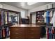 Walk-in closet with custom storage solutions for clothes, shoes, and accessories at 14841 W Warren Ave, Lakewood, CO 80228