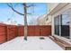 Small backyard with wood fence and snow covered ground at 4626 S Dillon Ct # B, Aurora, CO 80015