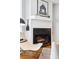 Cozy living room fireplace with a modern design and wood logs at 4626 S Dillon Ct # B, Aurora, CO 80015