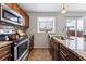 Modern kitchen featuring granite countertops and stainless steel appliances at 4626 S Dillon Ct # B, Aurora, CO 80015