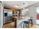 Modern kitchen with granite countertops and breakfast bar at 4626 S Dillon Ct # B, Aurora, CO 80015