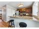 Kitchen with granite counters, stainless steel appliances, and breakfast bar at 4626 S Dillon Ct # B, Aurora, CO 80015