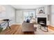 Living room with hardwood floors and fireplace, near entryway at 4626 S Dillon Ct # B, Aurora, CO 80015