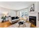 Spacious living room with hardwood floors, fireplace, and comfortable seating at 4626 S Dillon Ct # B, Aurora, CO 80015