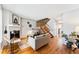 Inviting living room featuring hardwood floors, a fireplace, and staircase at 4626 S Dillon Ct # B, Aurora, CO 80015