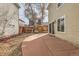 Patio features a wooden privacy fence, access to the home, and landscaping at 20000 E Mitchell Pl # 34, Denver, CO 80249