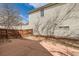Home's backyard is complete with a stone pathway and wooden privacy fence at 20000 E Mitchell Pl # 34, Denver, CO 80249