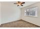 Bedroom featuring a window providing natural light and neutral-colored carpet at 20000 E Mitchell Pl # 34, Denver, CO 80249
