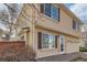 Exterior shot of a two-story home featuring brown shutters and manicured landscaping at 20000 E Mitchell Pl # 34, Denver, CO 80249