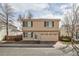 Two-story home with a two-car garage, manicured lawn, and beautiful landscaping at 20000 E Mitchell Pl # 34, Denver, CO 80249