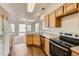 Bright kitchen featuring light wood cabinets, stainless steel appliances, and dark wood laminate flooring at 20000 E Mitchell Pl # 34, Denver, CO 80249