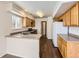 Functional kitchen featuring wood cabinets, sleek countertops, and ample natural light at 20000 E Mitchell Pl # 34, Denver, CO 80249