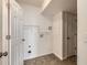 Functional laundry room with tile flooring and storage, ready for appliances at 20000 E Mitchell Pl # 34, Denver, CO 80249