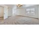 Expansive main bedroom with neutral carpet, ceiling fan, and large windows at 20000 E Mitchell Pl # 34, Denver, CO 80249