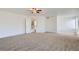 Large primary bedroom featuring neutral carpet and an ensuite bathroom at 20000 E Mitchell Pl # 34, Denver, CO 80249