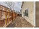 The side yard features rock landscaping and a wooden privacy fence at 20000 E Mitchell Pl # 34, Denver, CO 80249