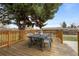 Spacious back deck with table and seating, perfect for outdoor dining at 7906 S Dover St, Littleton, CO 80128