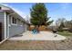 Backyard view with patio, fire pit and built in wood deck for entertaining at 7906 S Dover St, Littleton, CO 80128