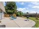 Backyard features a fire pit, patio, a built in wood deck and lawn at 7906 S Dover St, Littleton, CO 80128