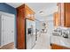 Beautiful kitchen features granite counters, tile backsplash, stainless appliances, and light wood cabinets at 7906 S Dover St, Littleton, CO 80128