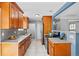 Stylish kitchen featuring granite countertops, stainless steel appliances, and tile backsplash at 7906 S Dover St, Littleton, CO 80128